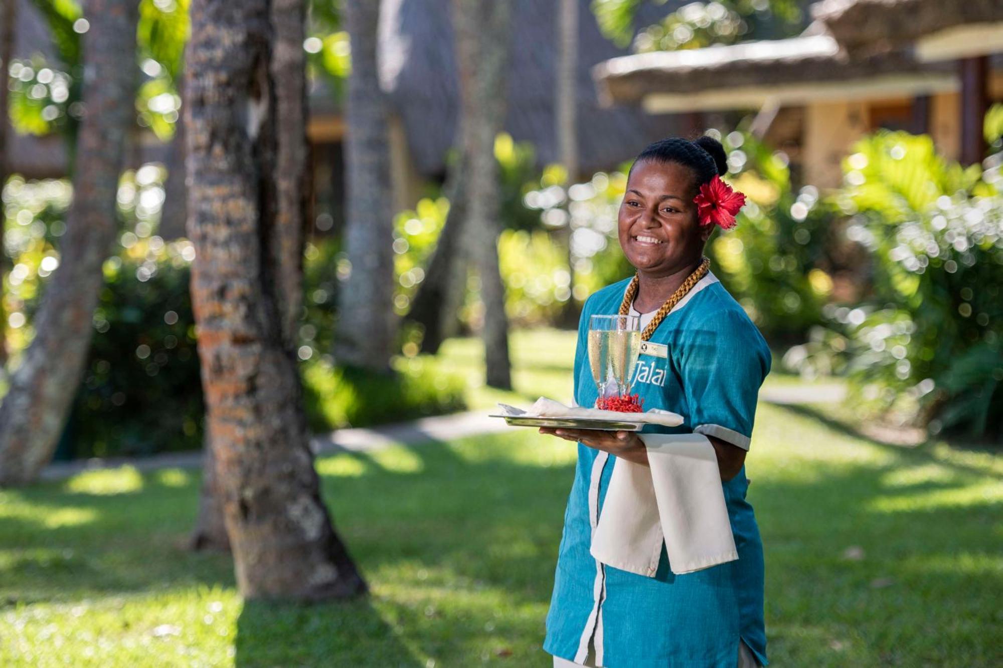 Outrigger Fiji Beach Resort Korotogo Exterior foto A hotel staff in Mauritius