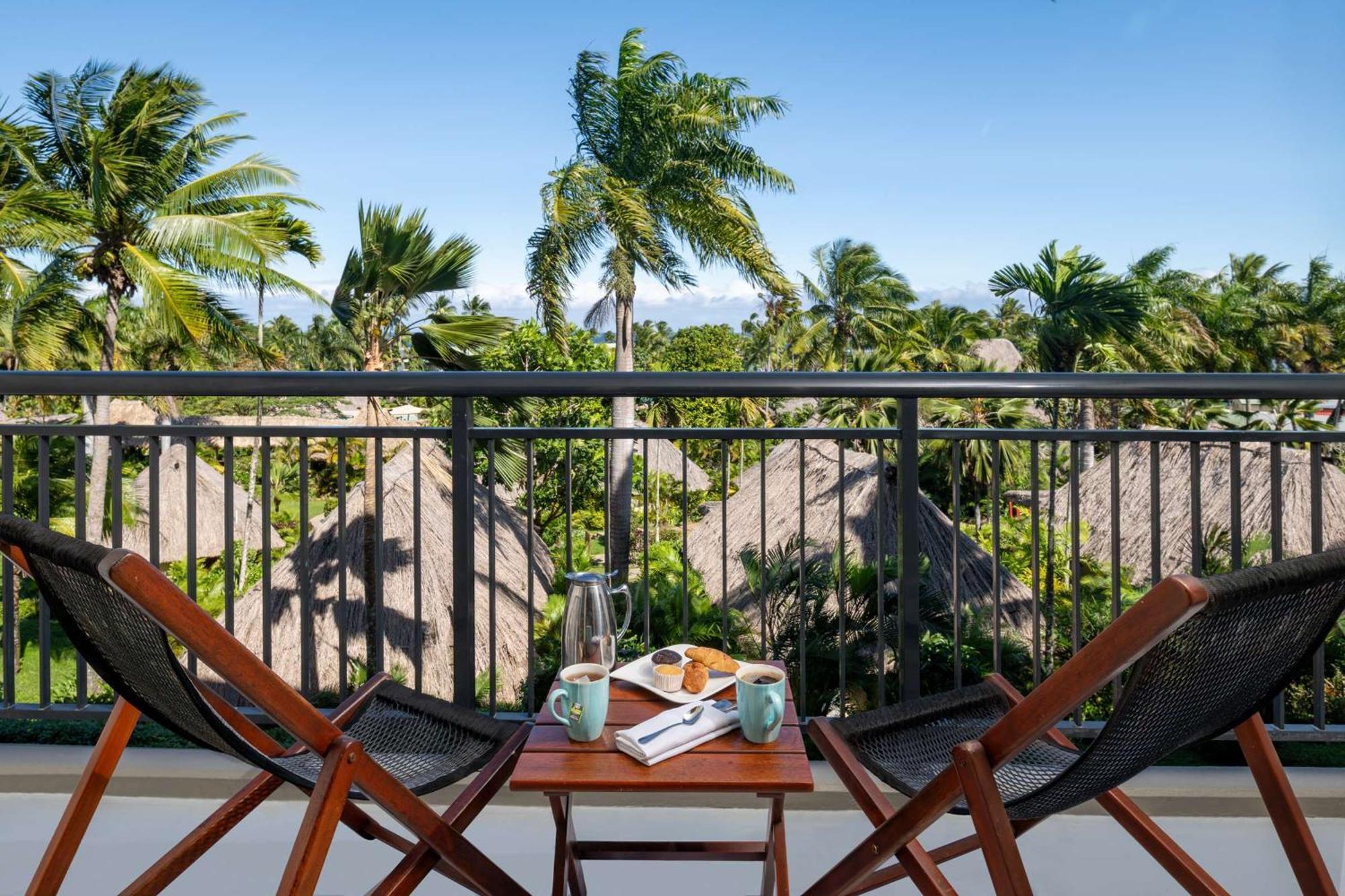 Outrigger Fiji Beach Resort Korotogo Exterior foto A balcony at the resort